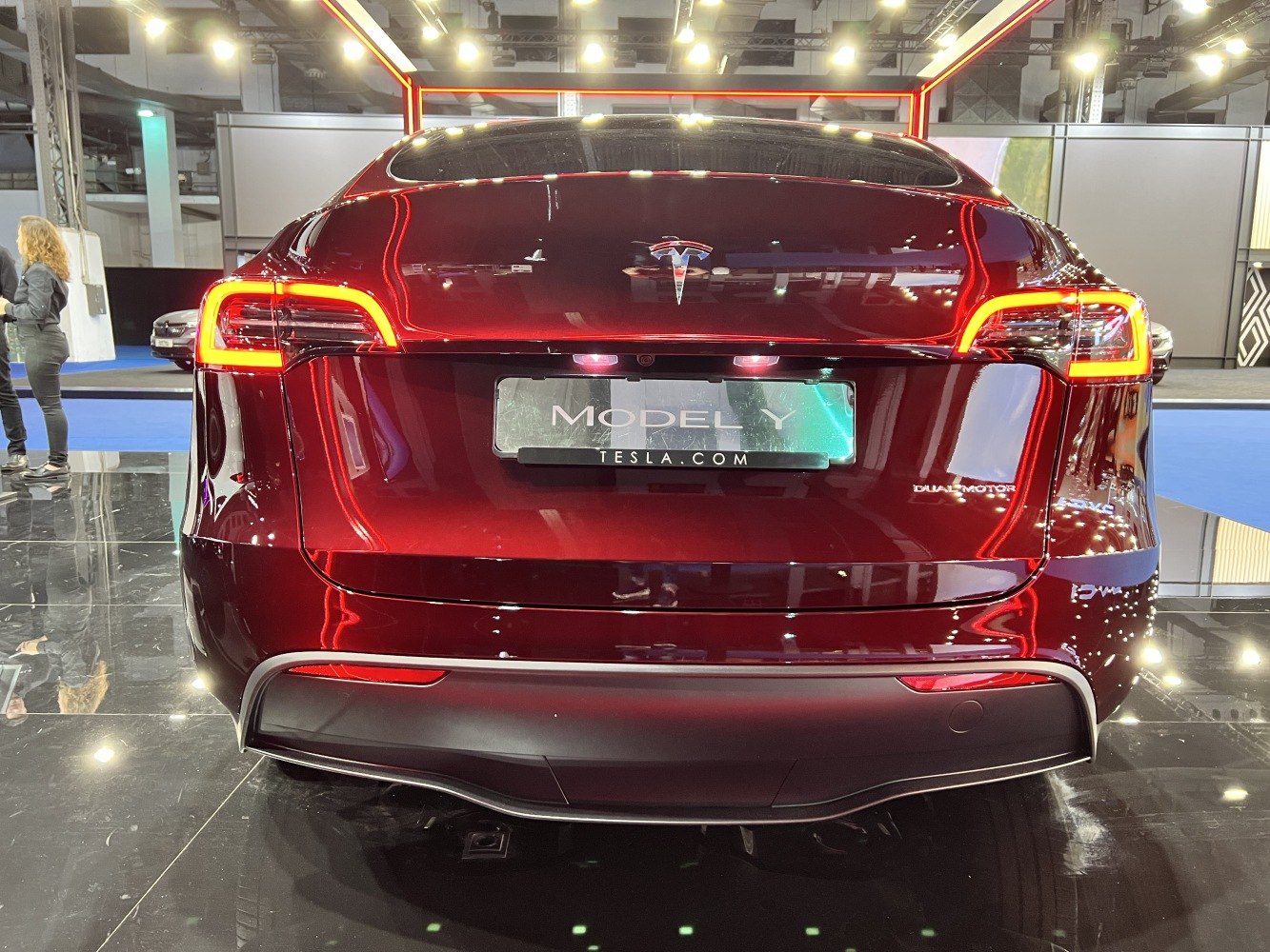 Rear view of electric SUV with LED tail lights and dual motor badge