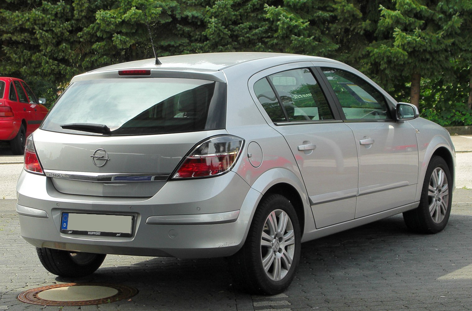 Silver hatchback rear, taillights, rear windshield, five-door layout