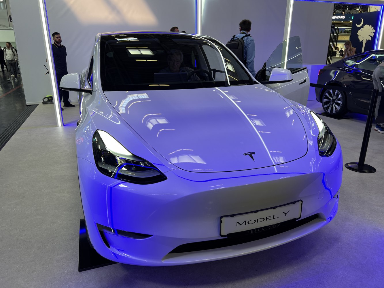 Front view of electric vehicle highlighting sleek hood and LED headlights