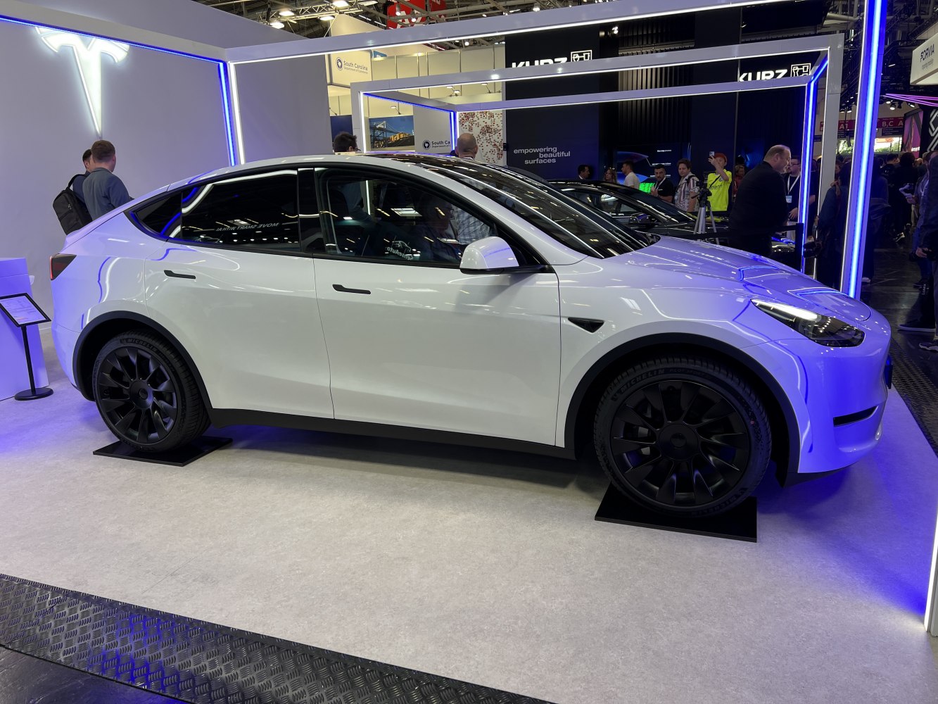 Sleek electric SUV with black alloy wheels and panoramic roof