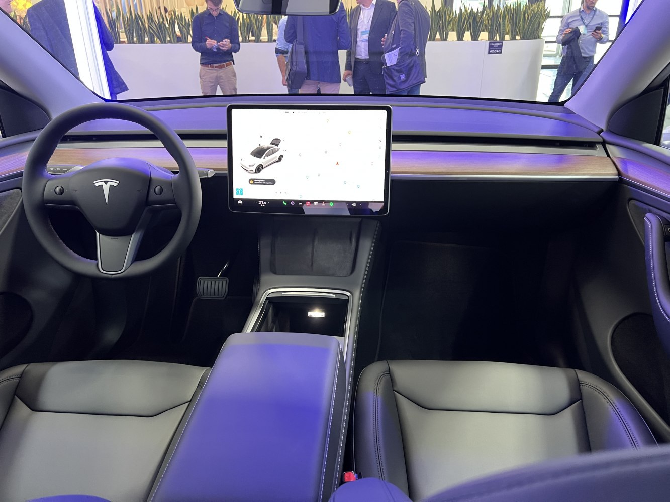 Minimalist interior with large central touchscreen and premium seats