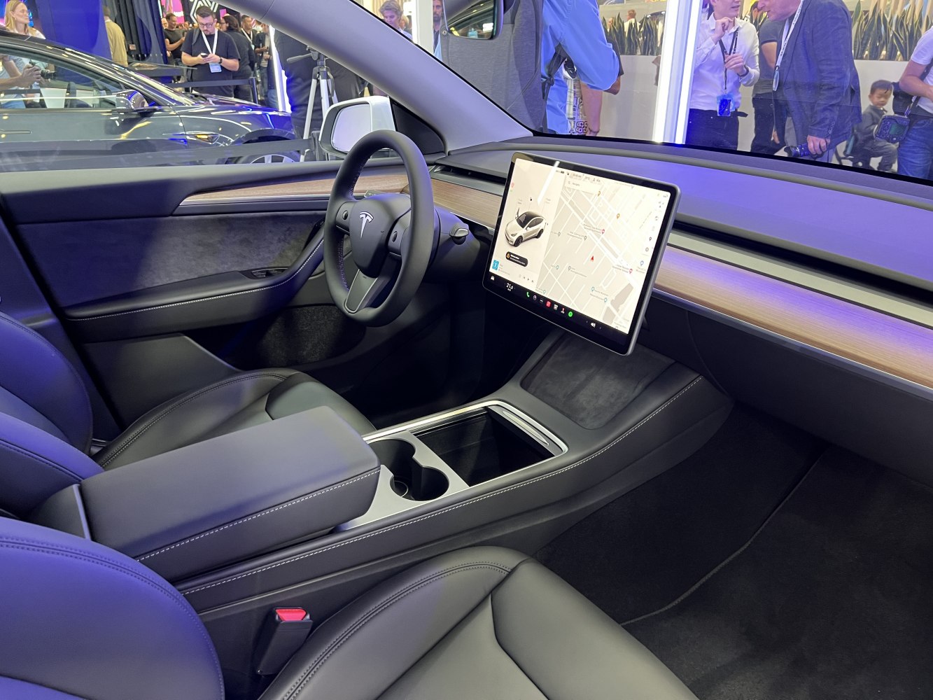 Minimalist interior with large touchscreen display and black leather seats