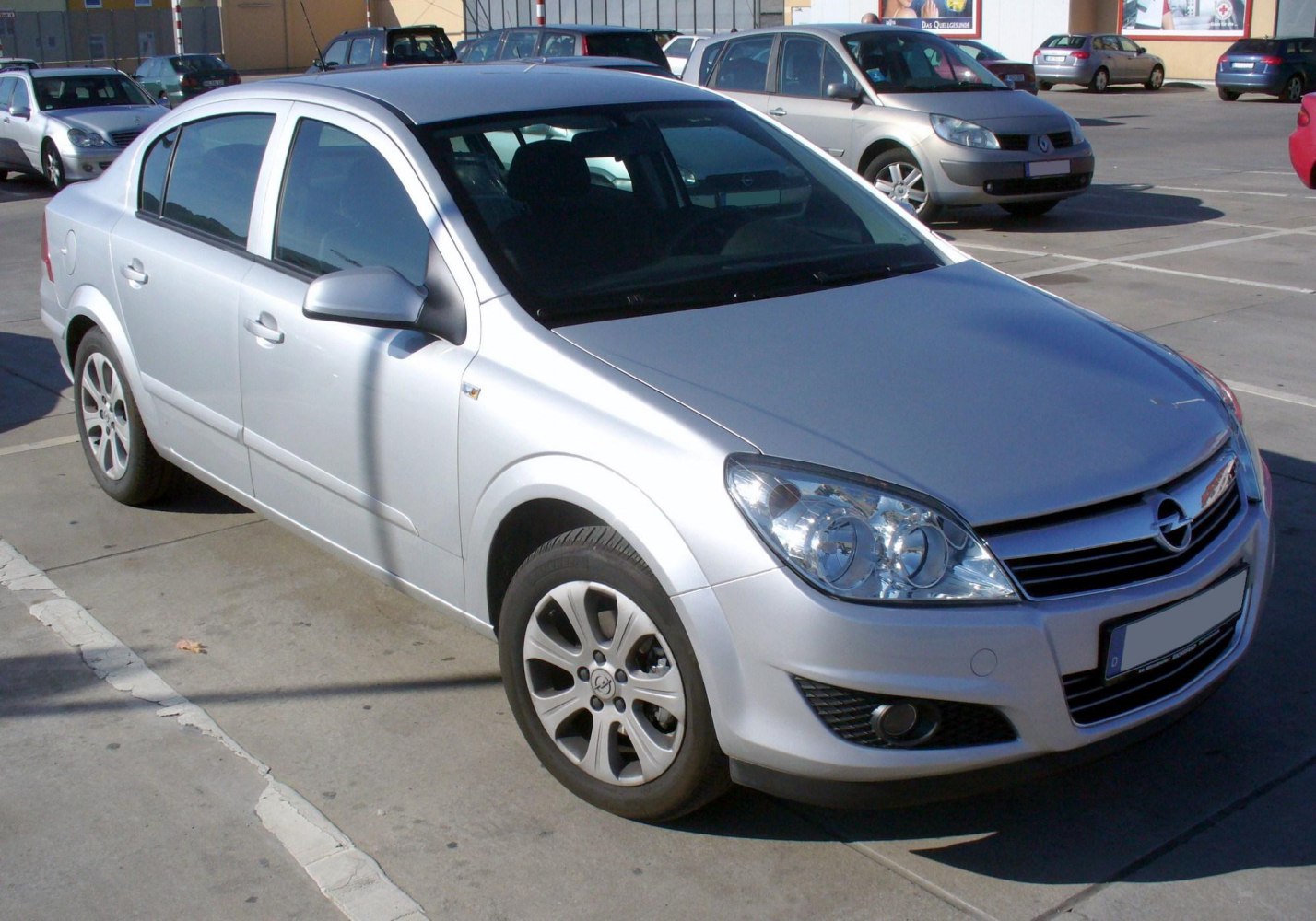 Silver sedan with front side view and alloy wheels