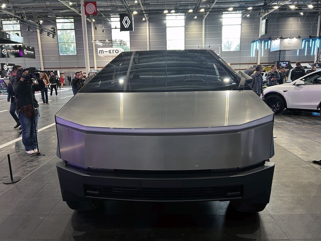 Futuristic angular front view of electric pickup with stainless steel body