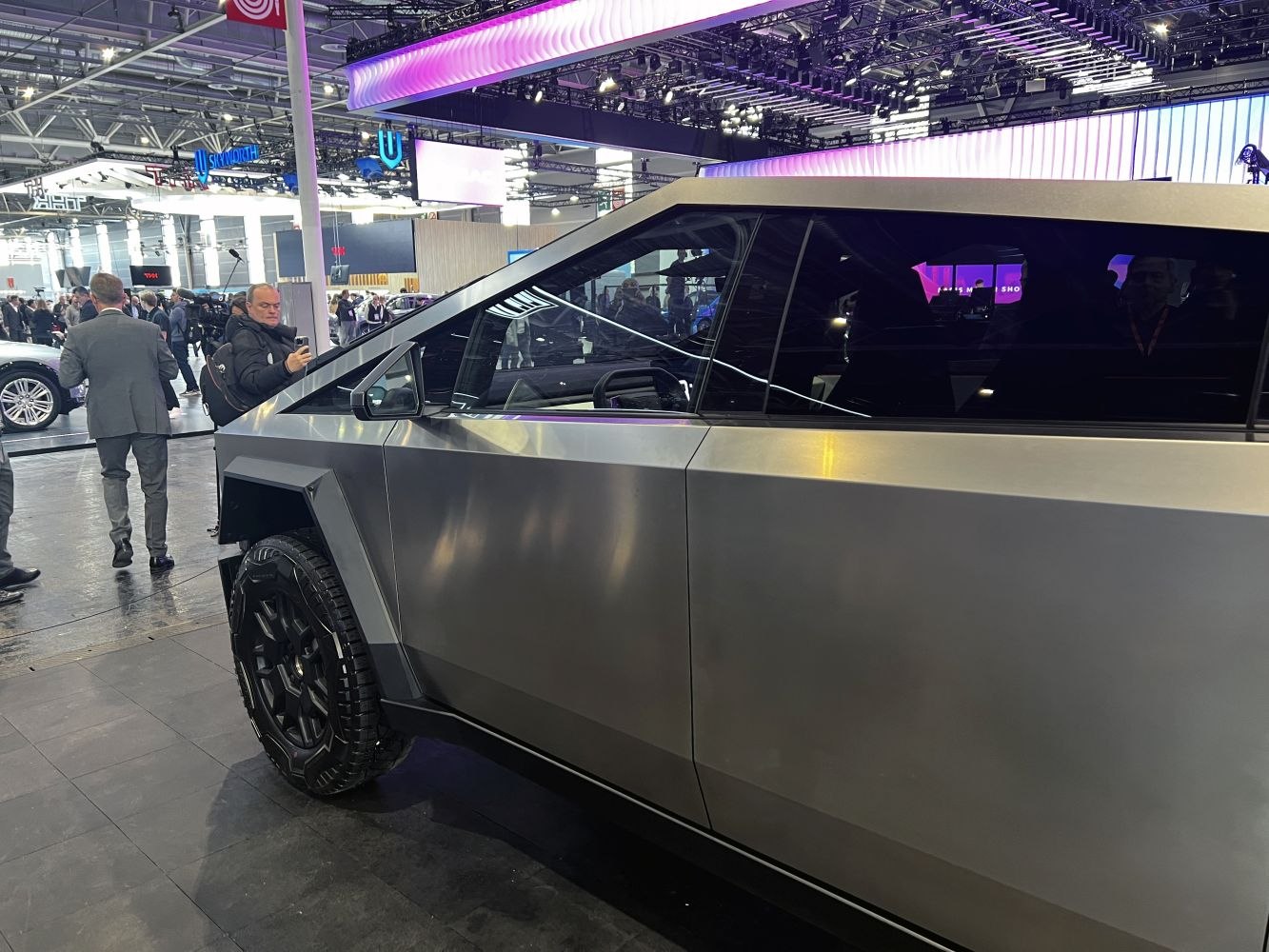 Angular side profile with large off-road tire on electric truck