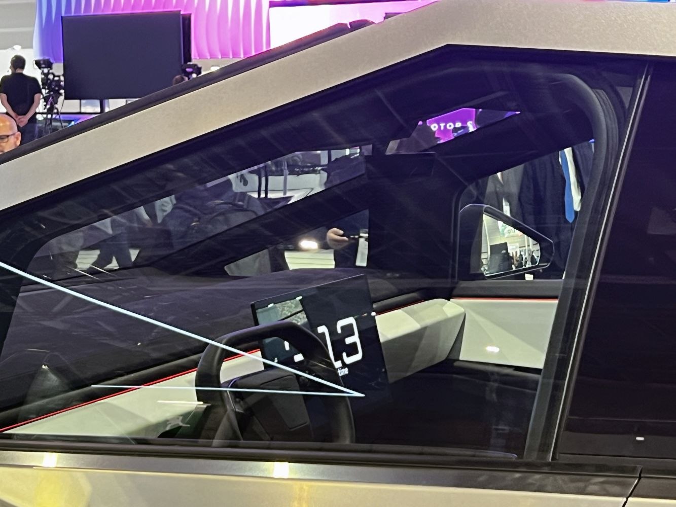 Futuristic dashboard and minimalist steering wheel design.