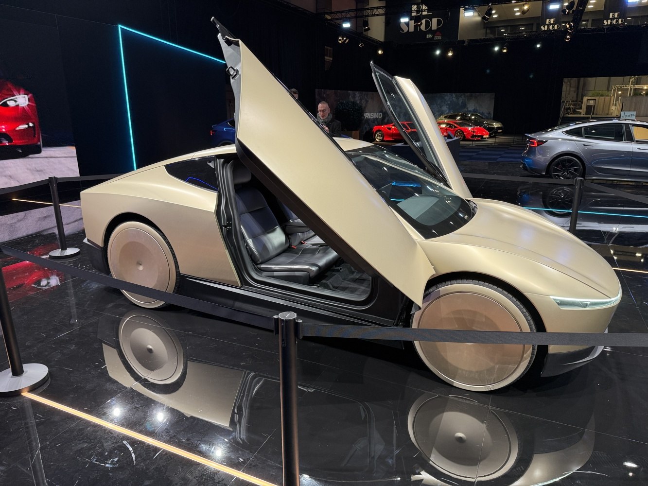 Futuristic gullwing doors and covered aerodynamic wheels