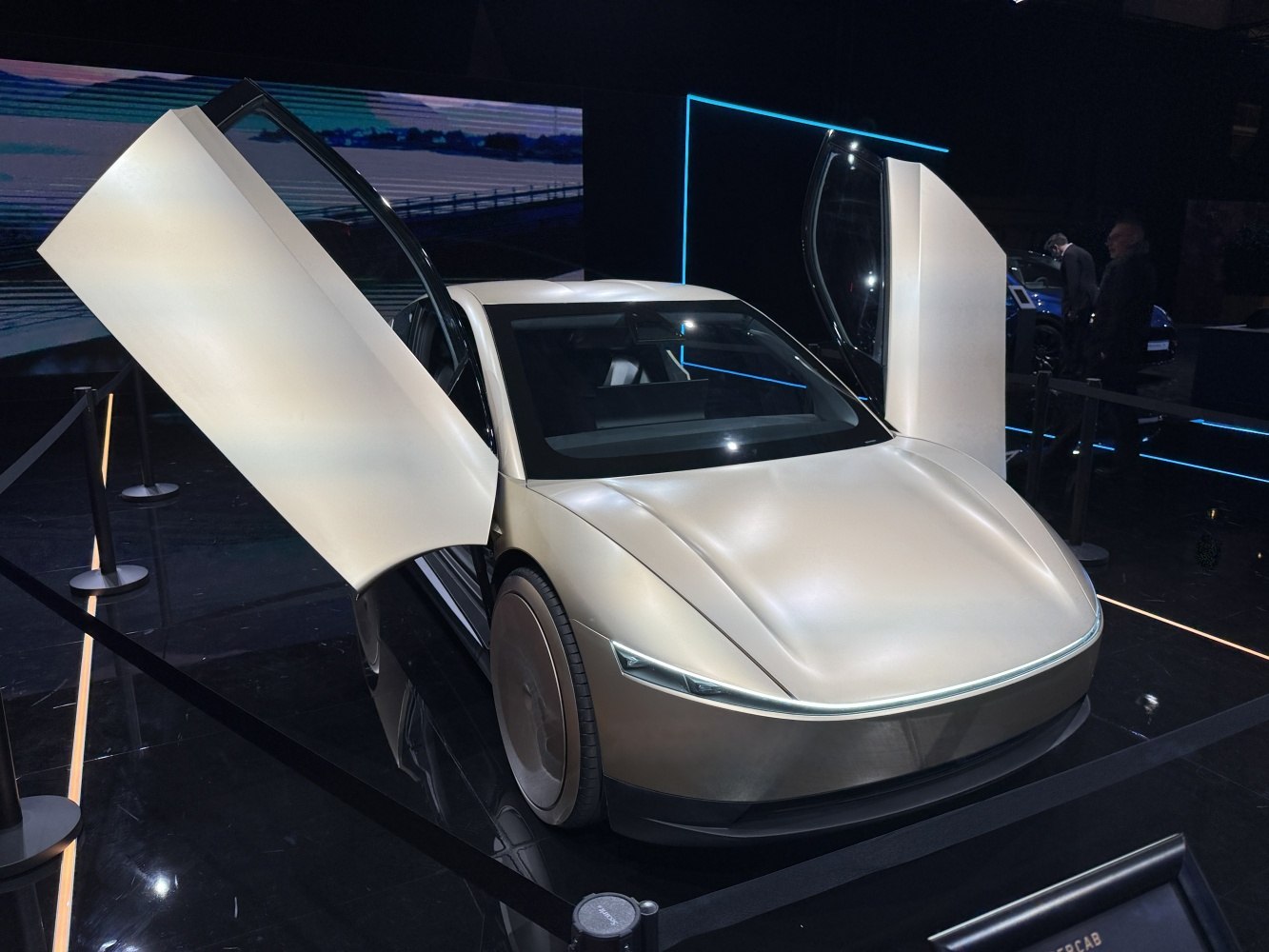 Futuristic concept vehicle with butterfly doors and aerodynamic design