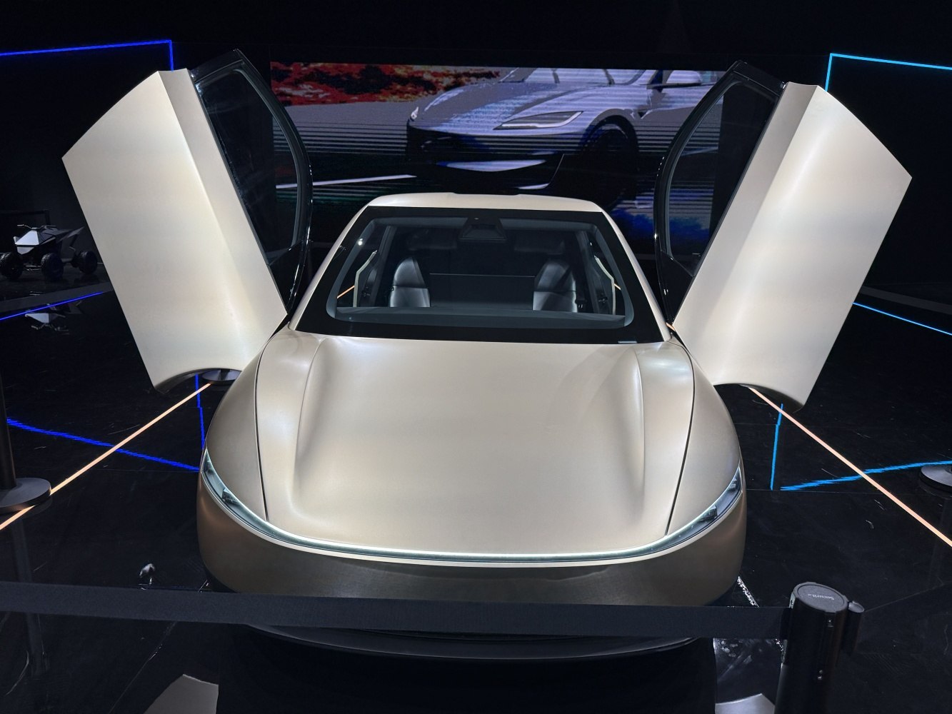 Sleek front with unique butterfly doors open wide