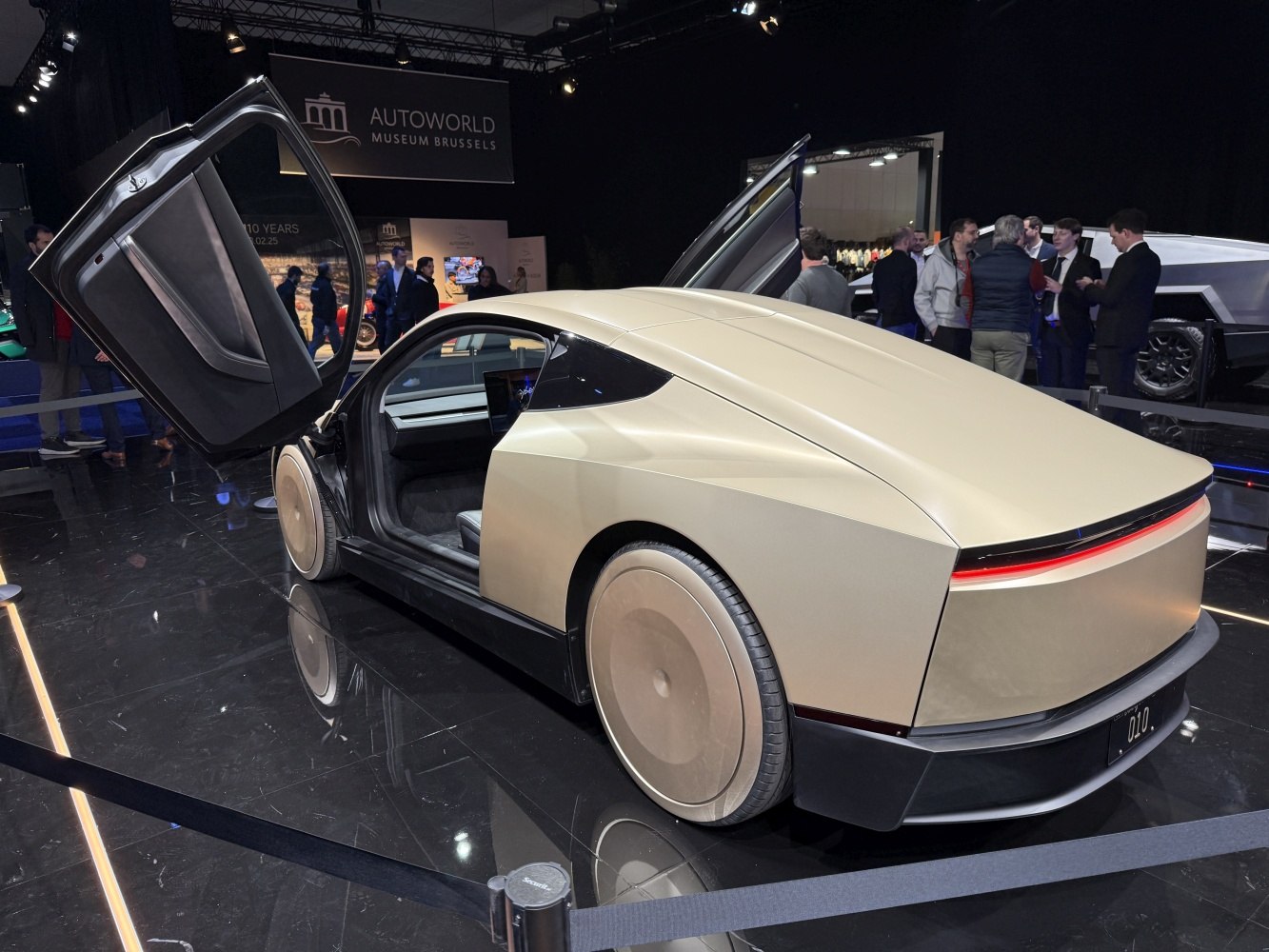 Falcon wing doors with sleek rear LED strip and covered aerodynamic wheels