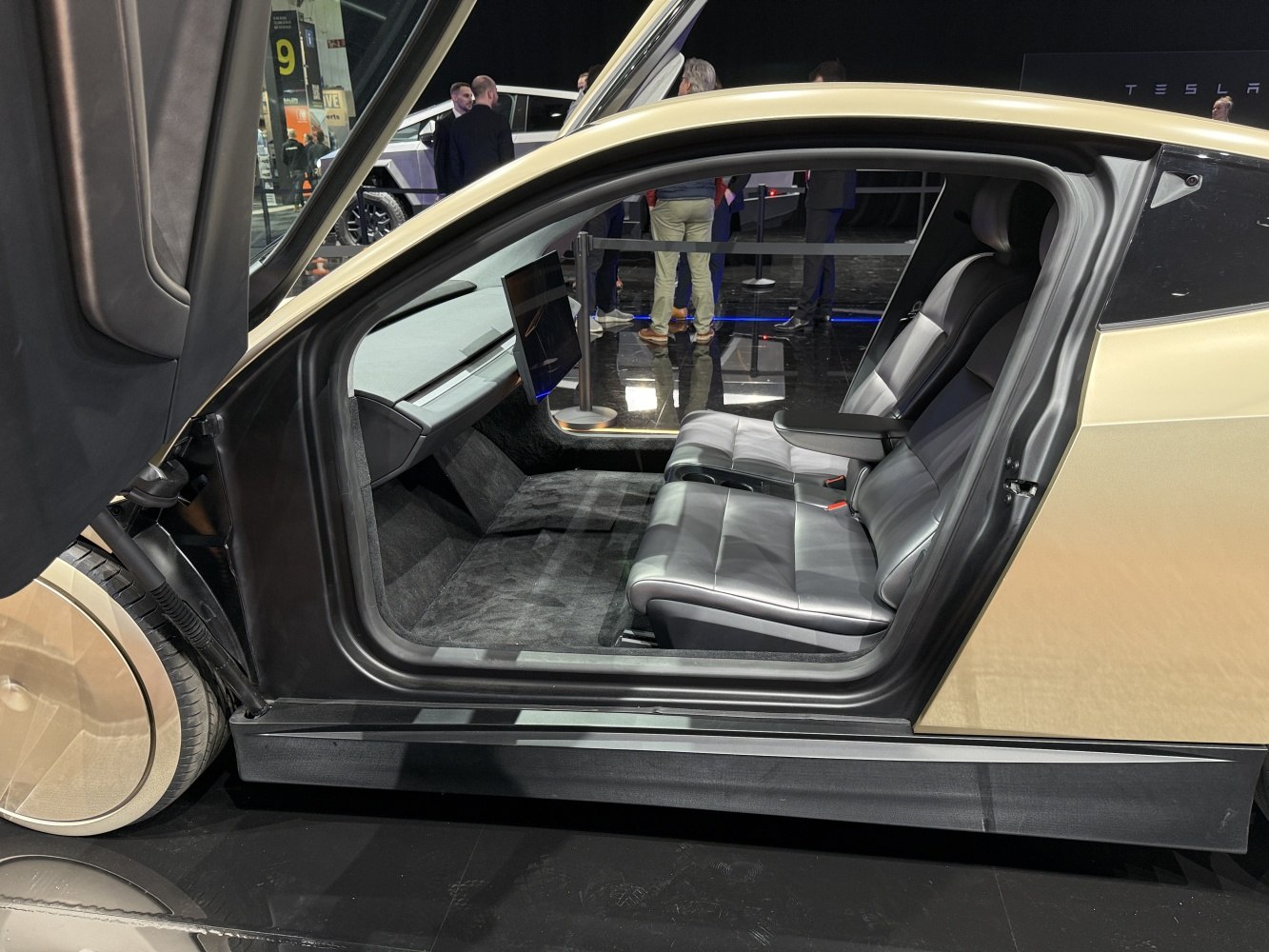 Futuristic car interior with sleek seats and central touchscreen display.