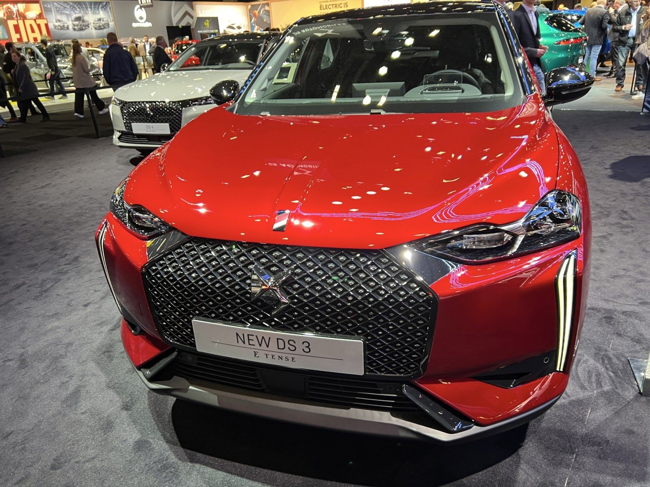 Modern front grille with diamond pattern and sleek LED headlights