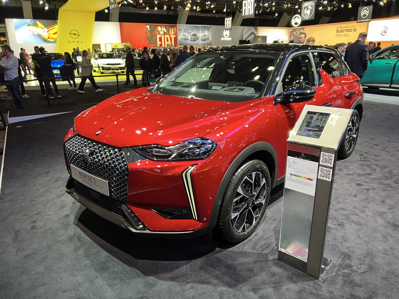 Red compact SUV front with distinctive grille and alloy wheels