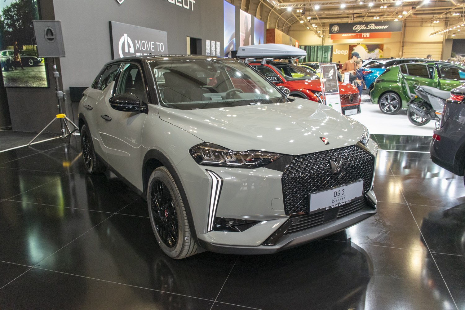 Bold front grille with vertical LED daytime running lights and black alloy wheels.