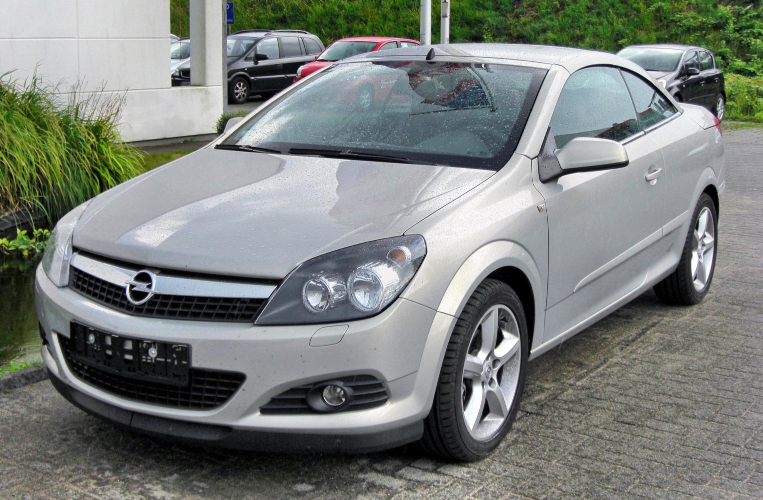 Front convertible view with sleek headlights and alloy wheels