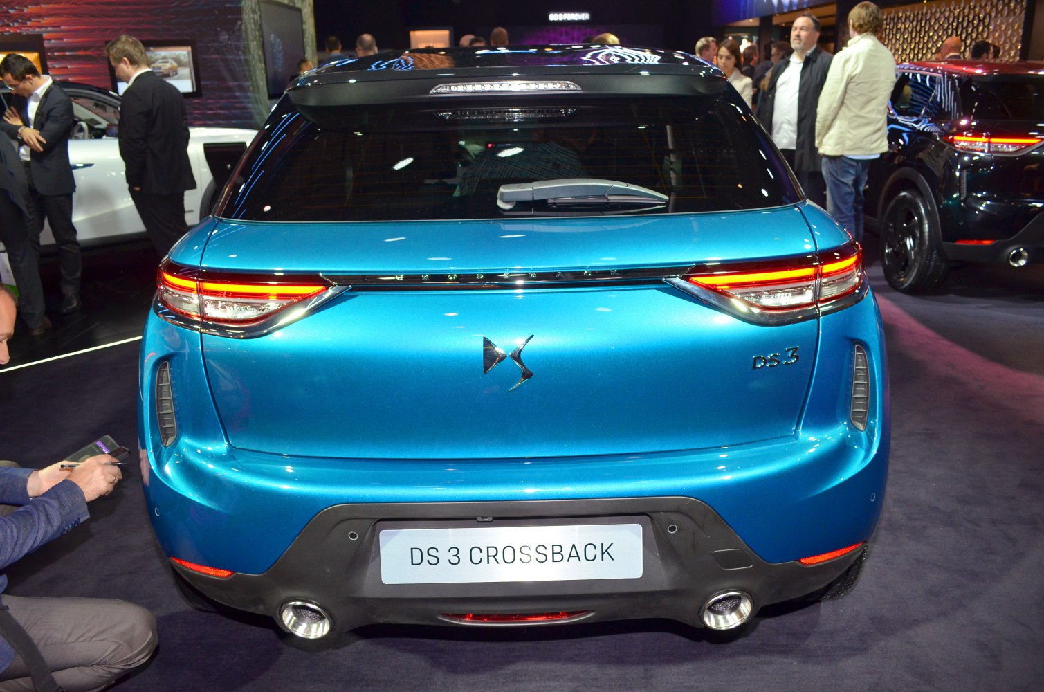 Rear view of compact SUV with LED taillights and dual exhausts
