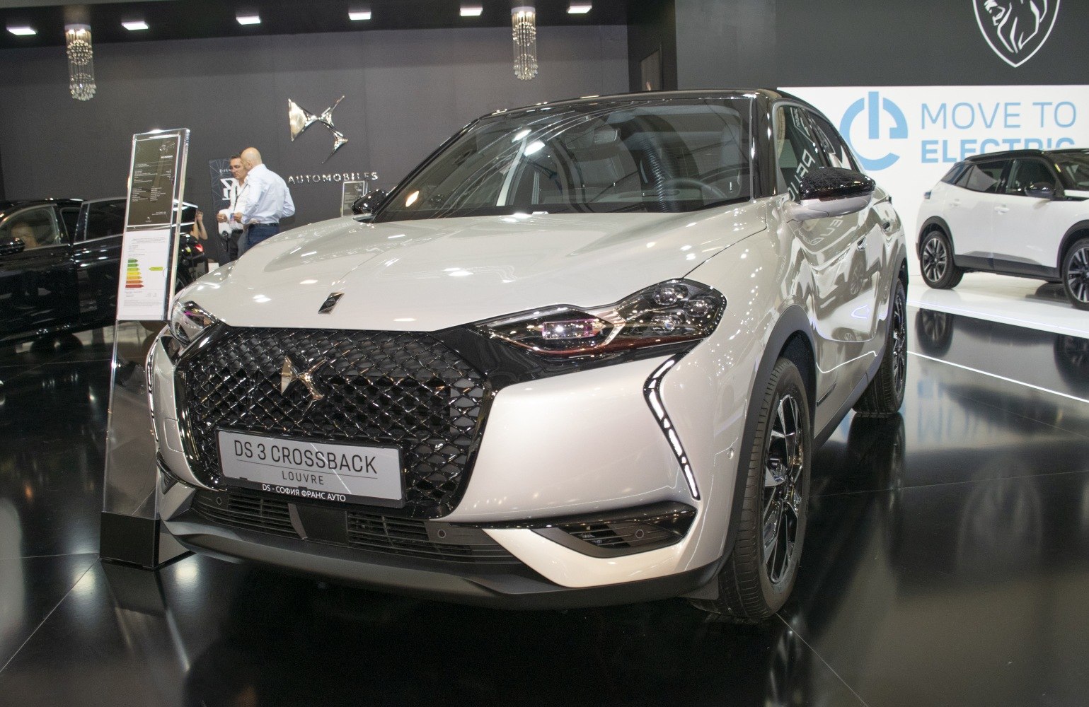 Close-up of car front with diamond grille and LED headlights