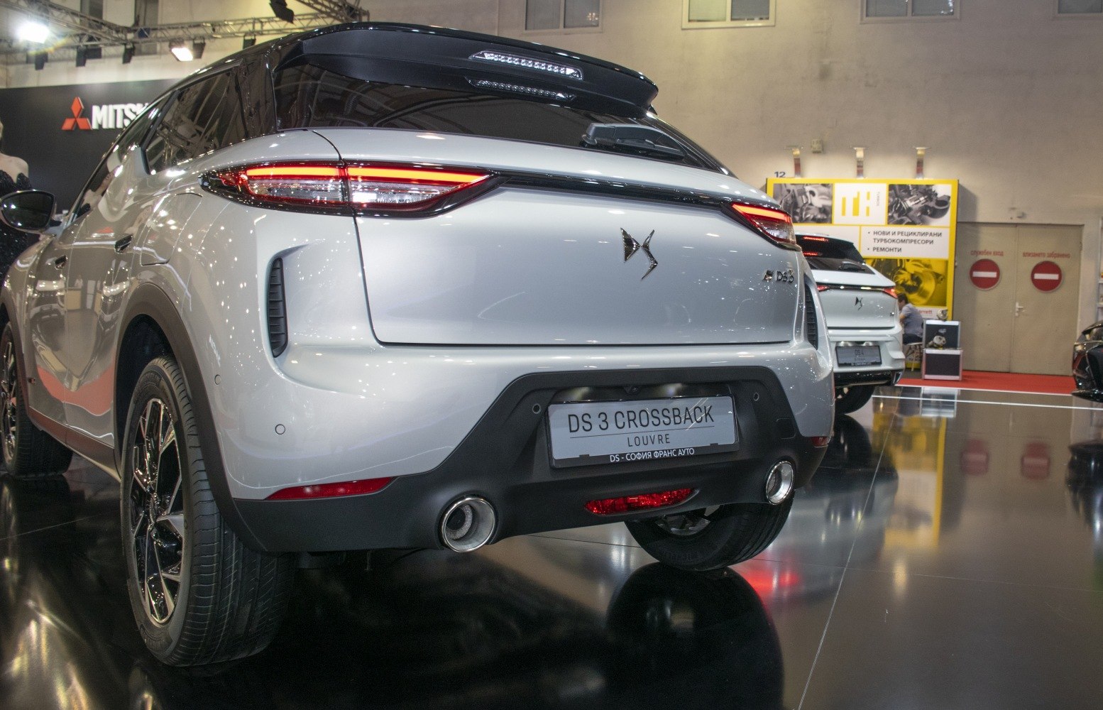 Rear view showcasing tail lights and dual exhausts