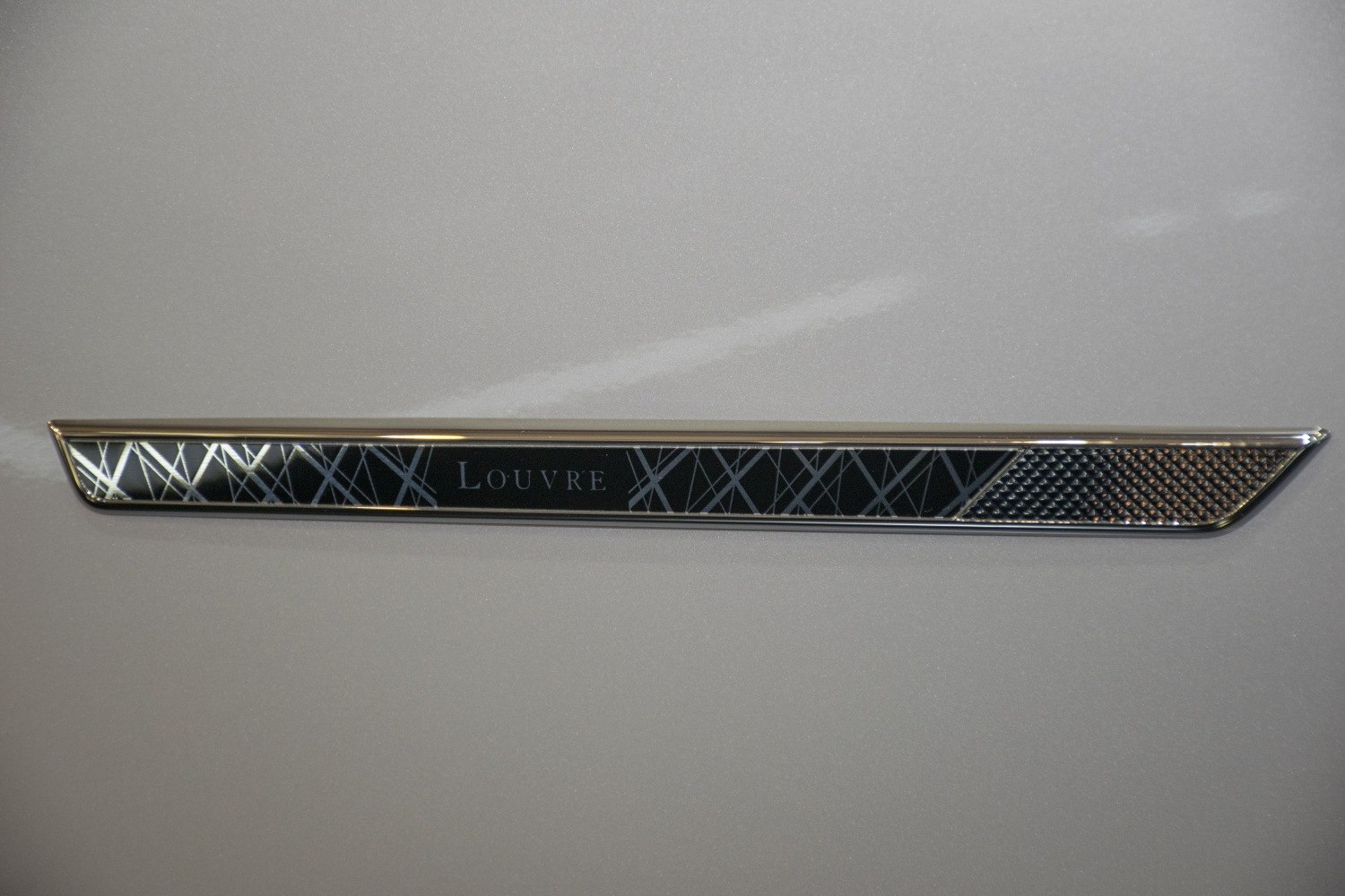 Close-up of Louvre edition side badge emblem