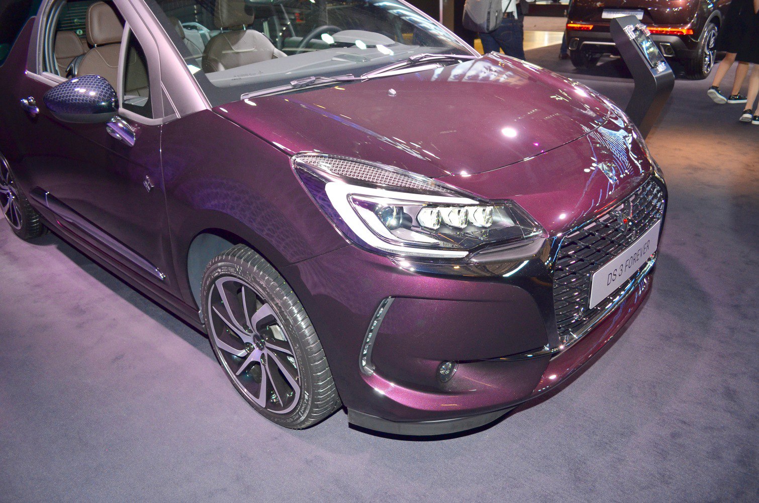 Front view with LED headlights, grille, and alloy wheels