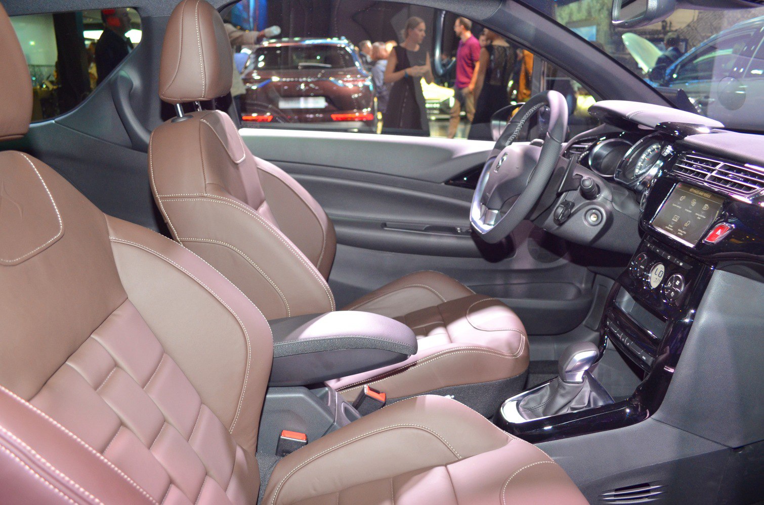 Leather seats with stitching and modern dashboard with center console