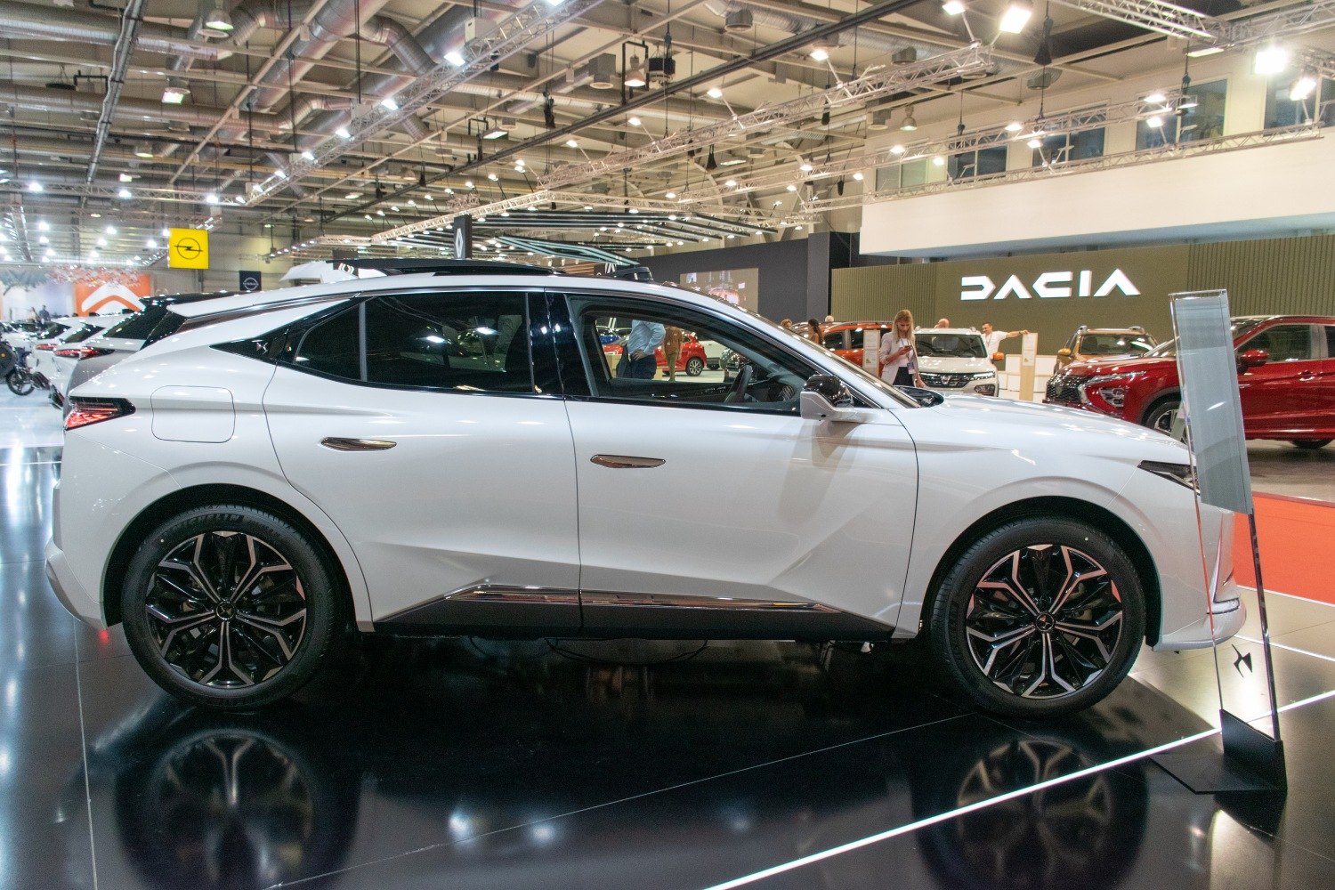 Side profile of a modern compact SUV with striking alloy wheels.