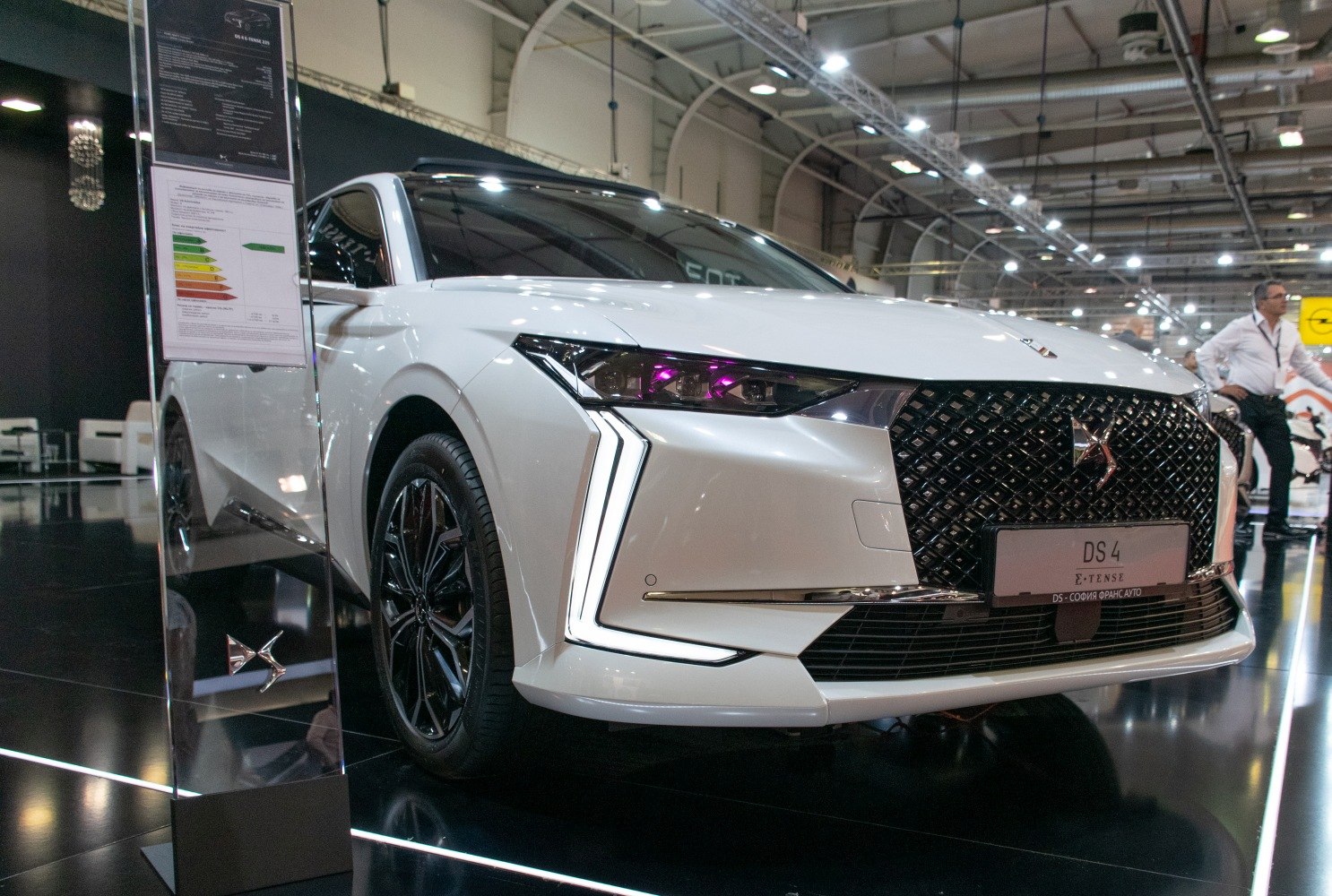 Front with distinctive LED headlights and black patterned grille