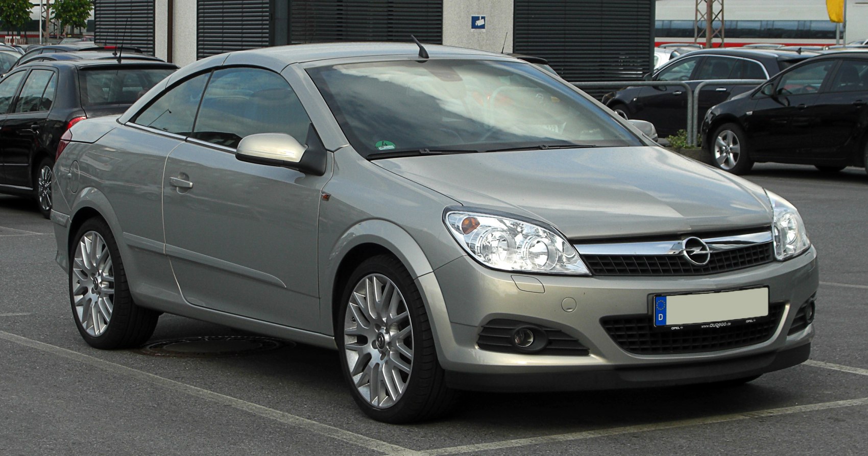 Convertible coupe with retractable hardtop and sporty alloy wheels