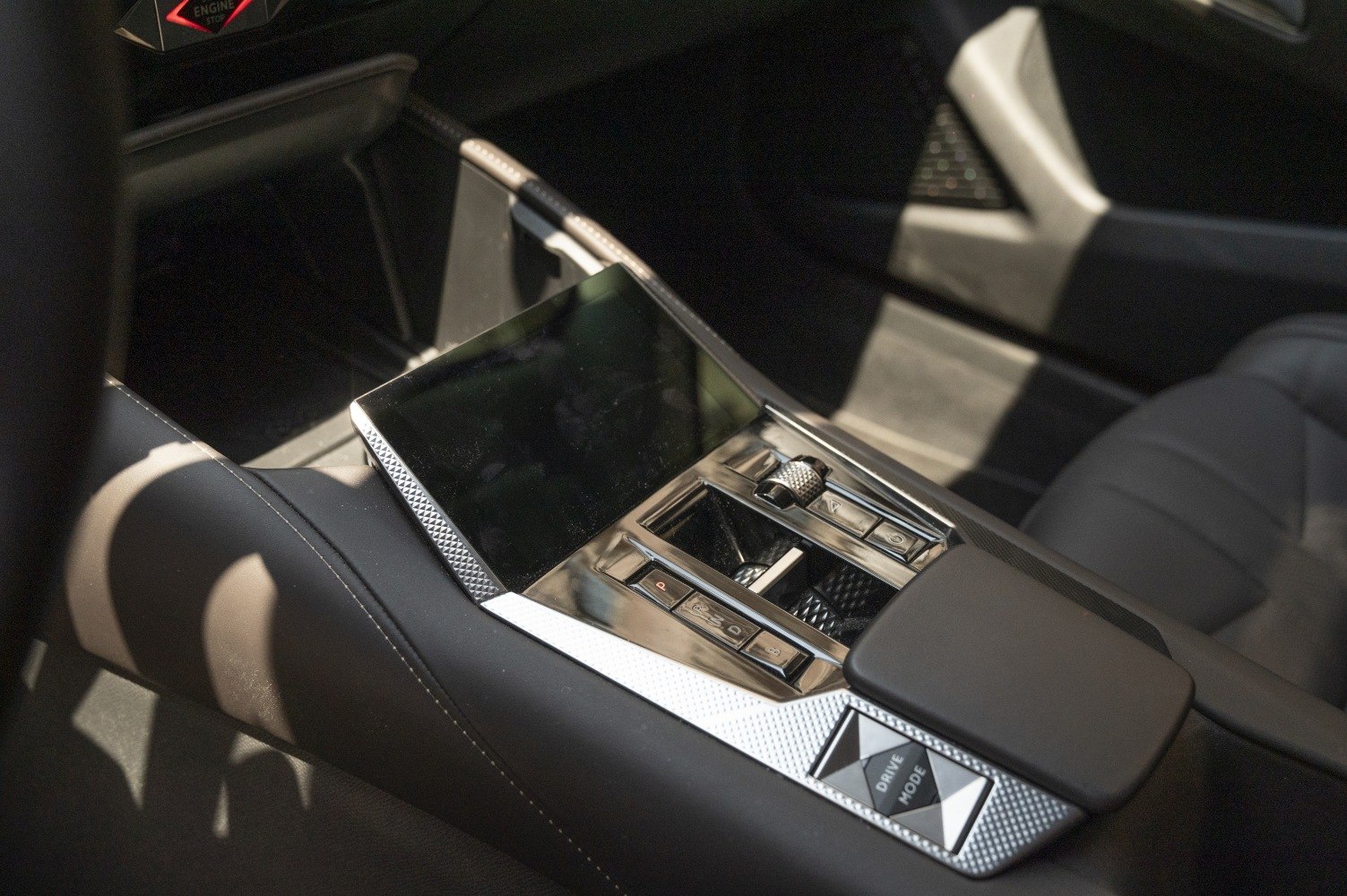 Center console with touchscreen, chrome trim, and control buttons