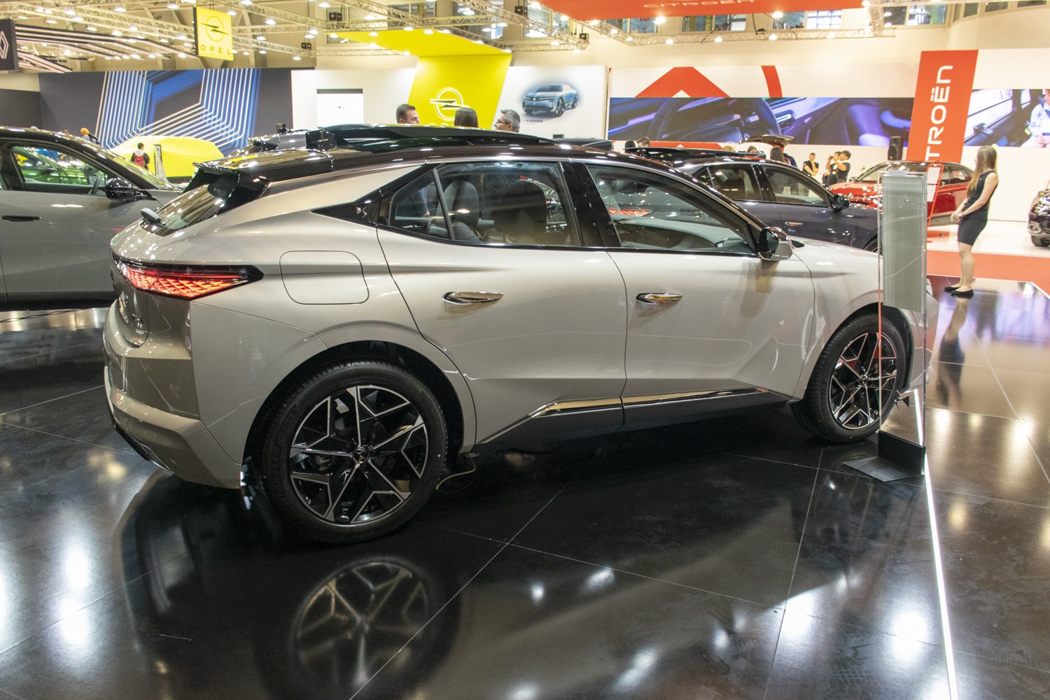 Rear side view of sleek hatchback with modern tail lights and alloy wheels