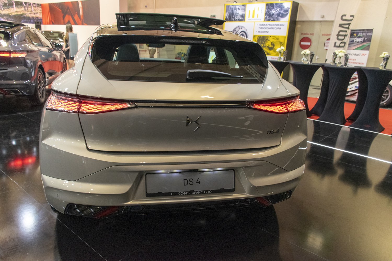 Rear view with sharp LED tail lights and hatchback design
