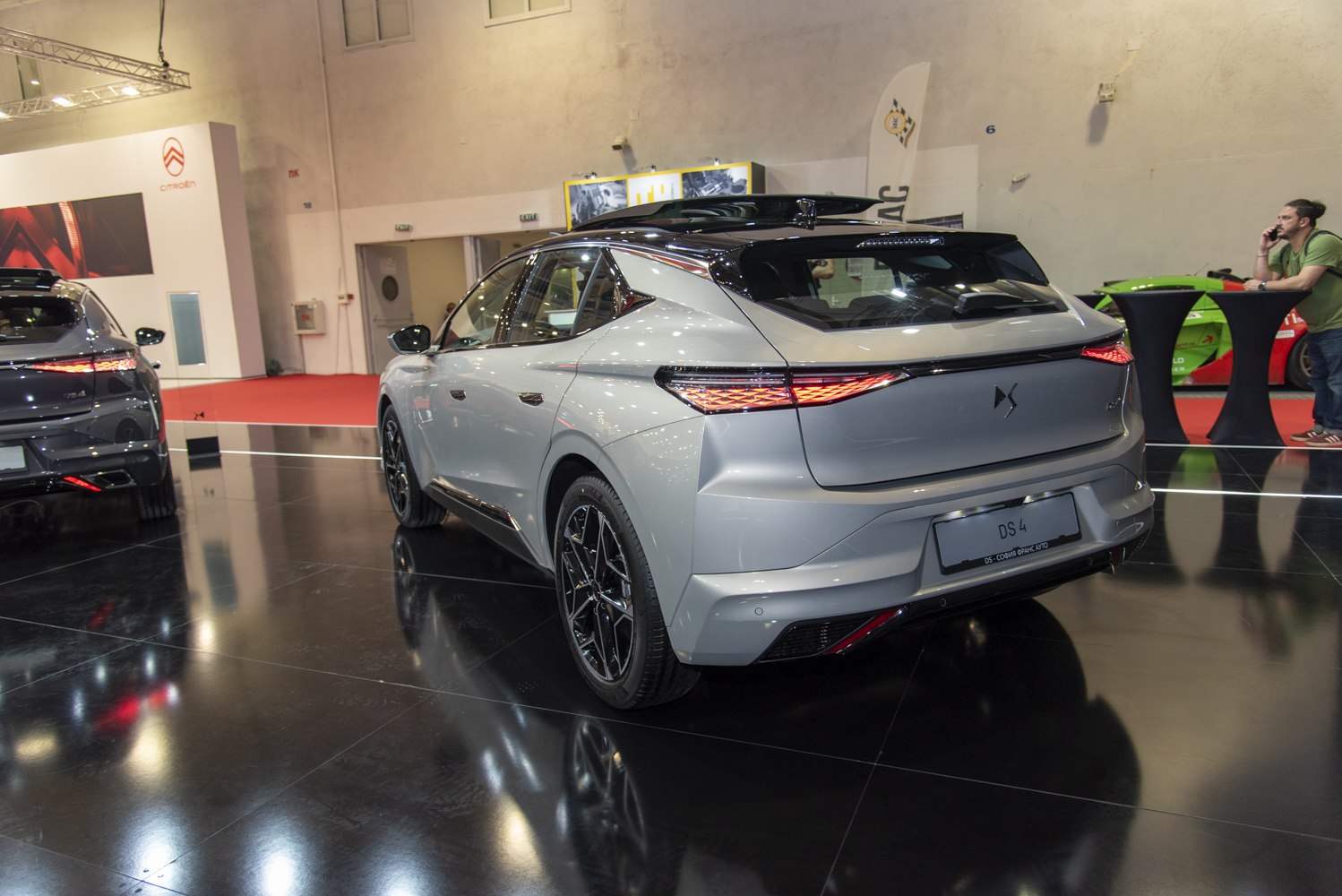 Rear view with illuminated taillights and sleek modern design
