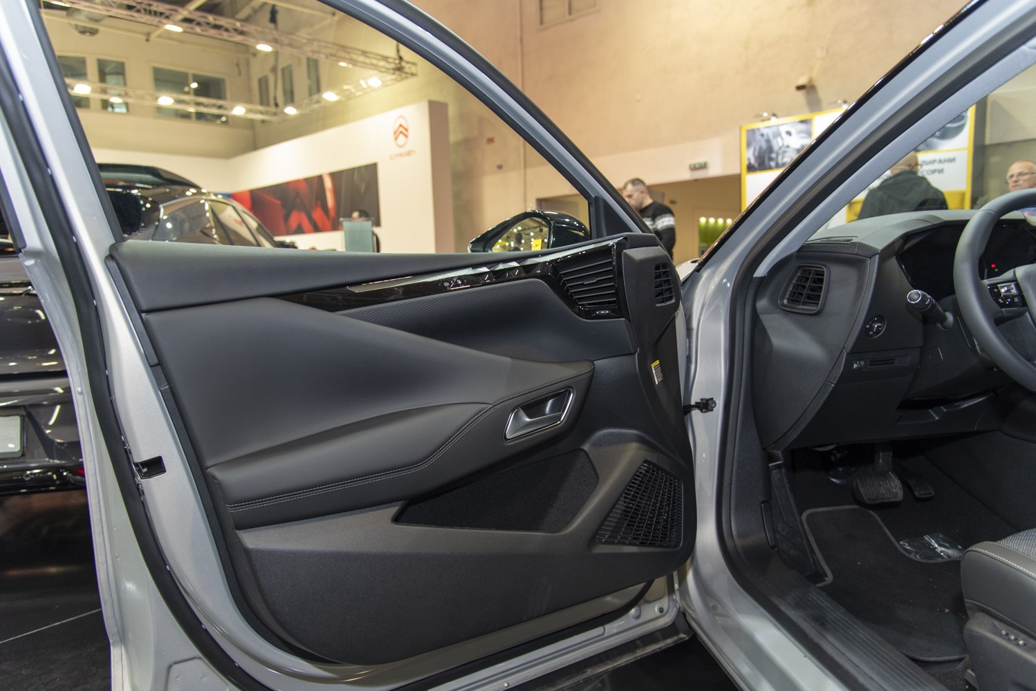 Car interior door panel with modern design and dashboard air vents