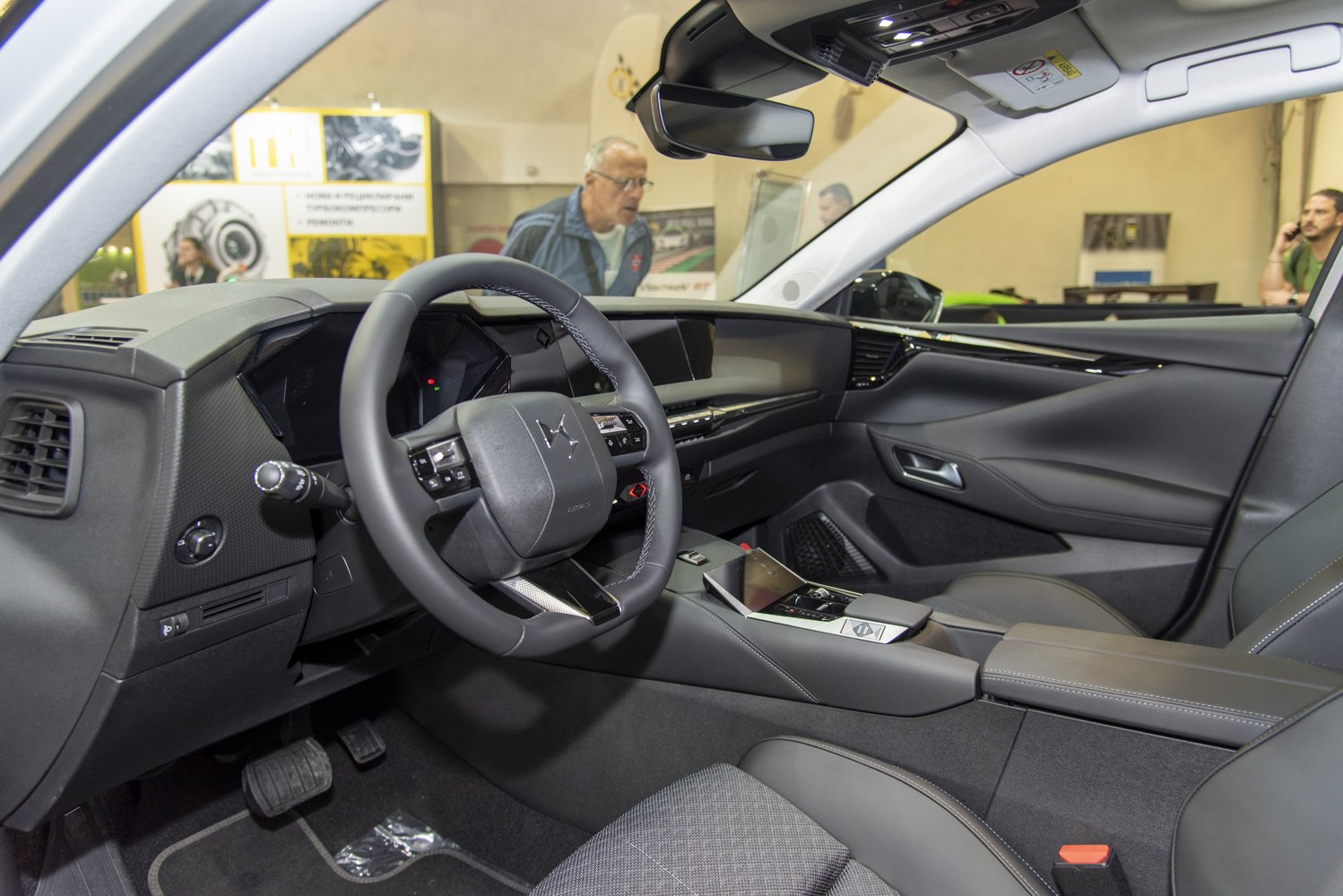 Modern car interior with digital dashboard and steering wheel controls