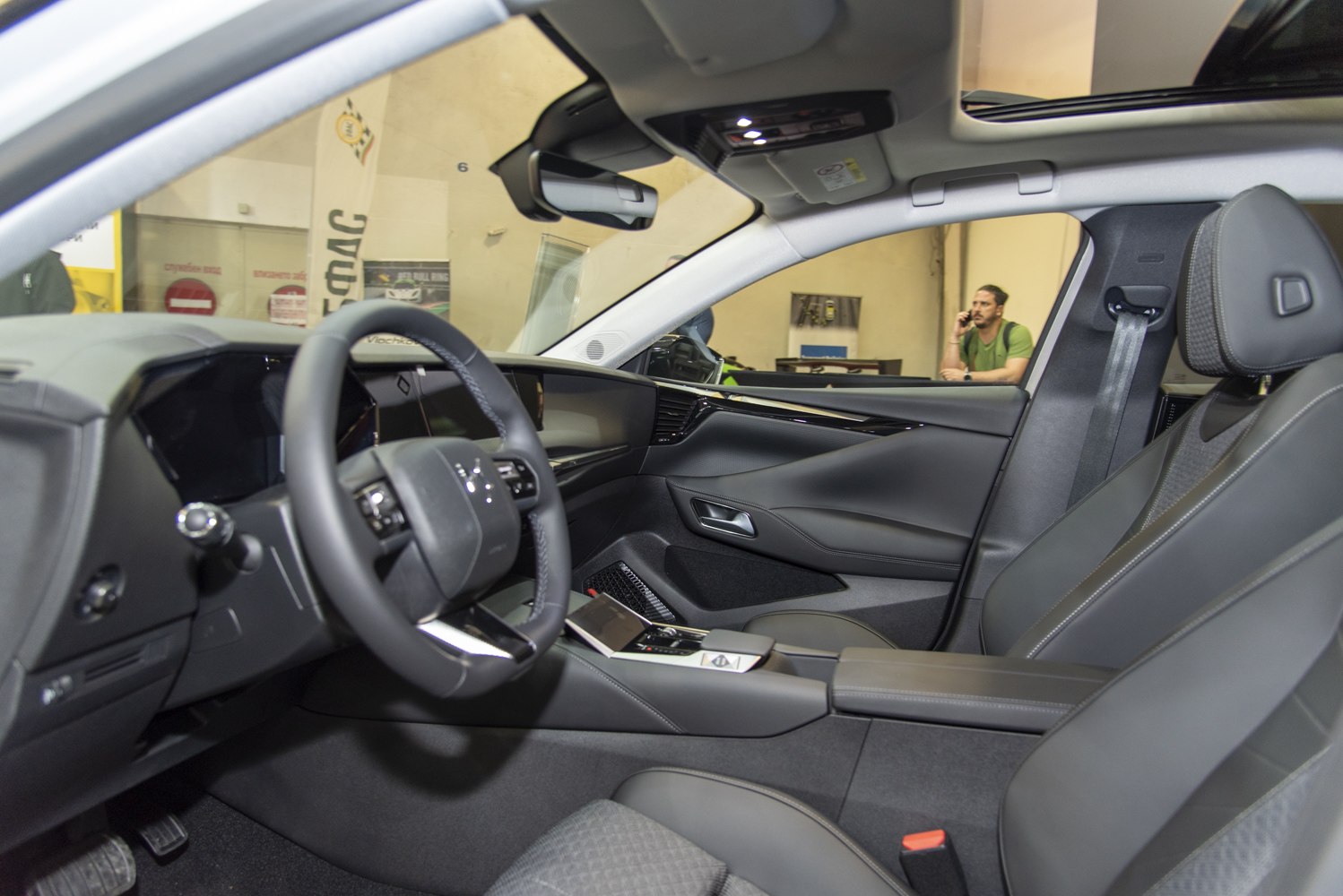 Modern steering wheel and digital dashboard with premium seats