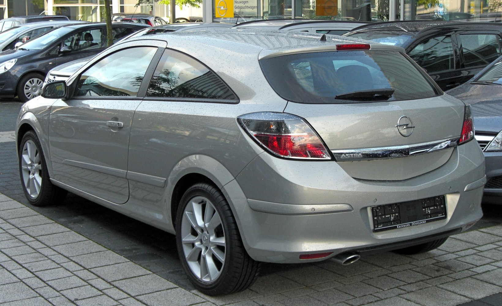 Compact 3-door hatchback rear and side with alloy wheels and taillights