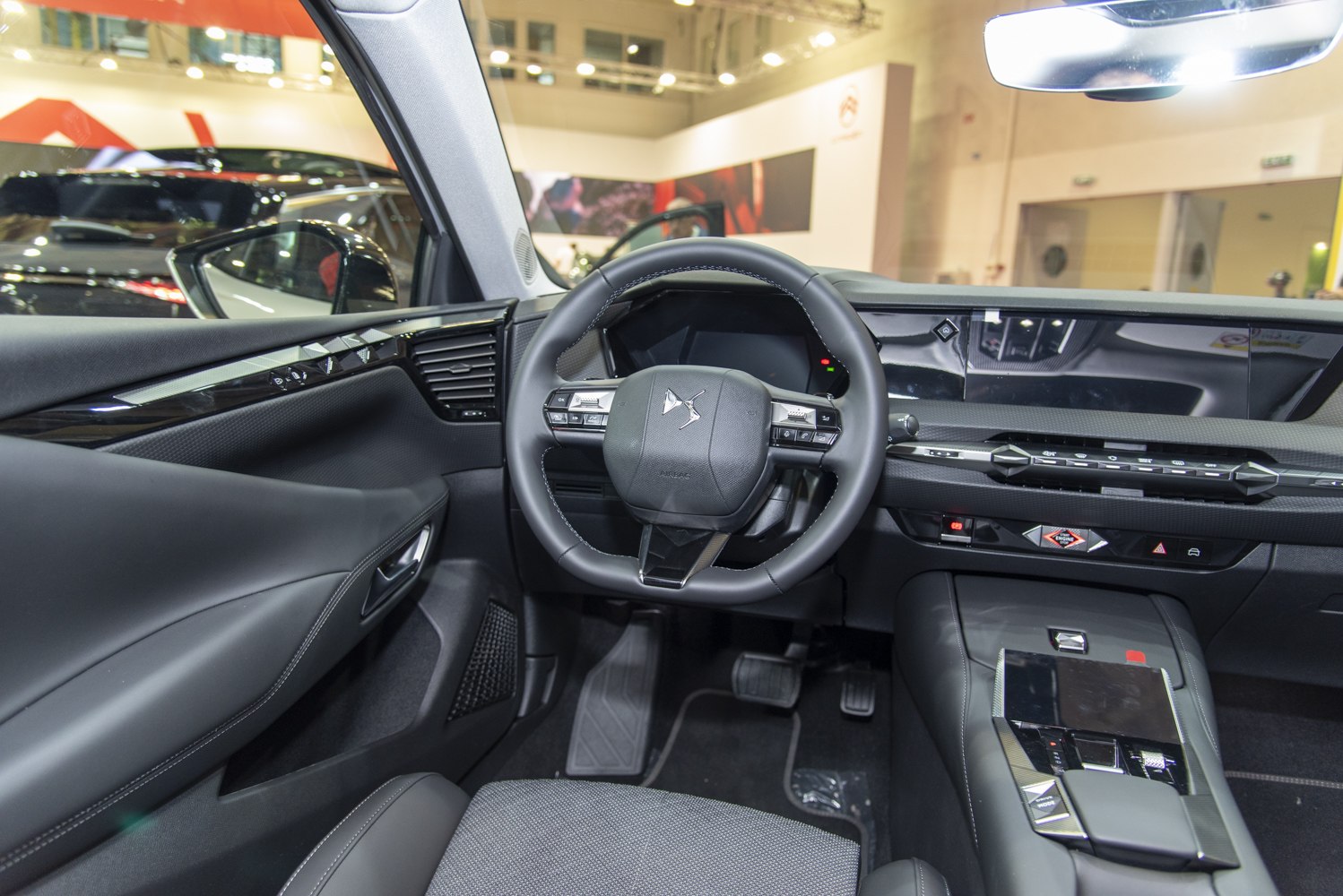 Modern car interior with dashboard and multifunction steering wheel