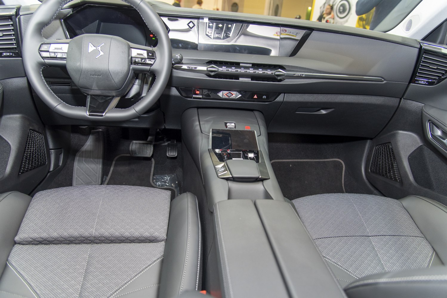Modern car interior with digital dashboard and multifunction steering wheel