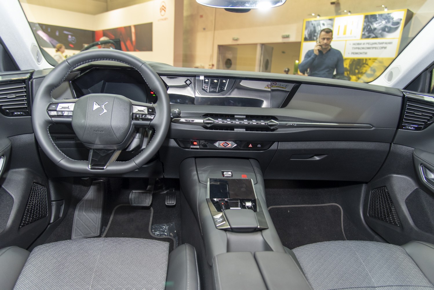 Modern dashboard and multifunctional steering wheel in a car interior