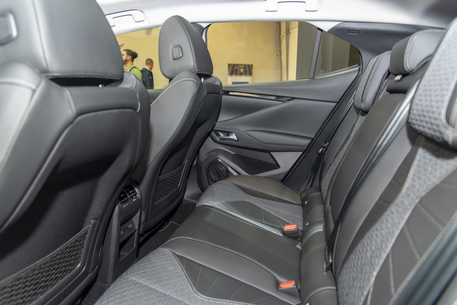 Premium leather and fabric rear seats with modern design.