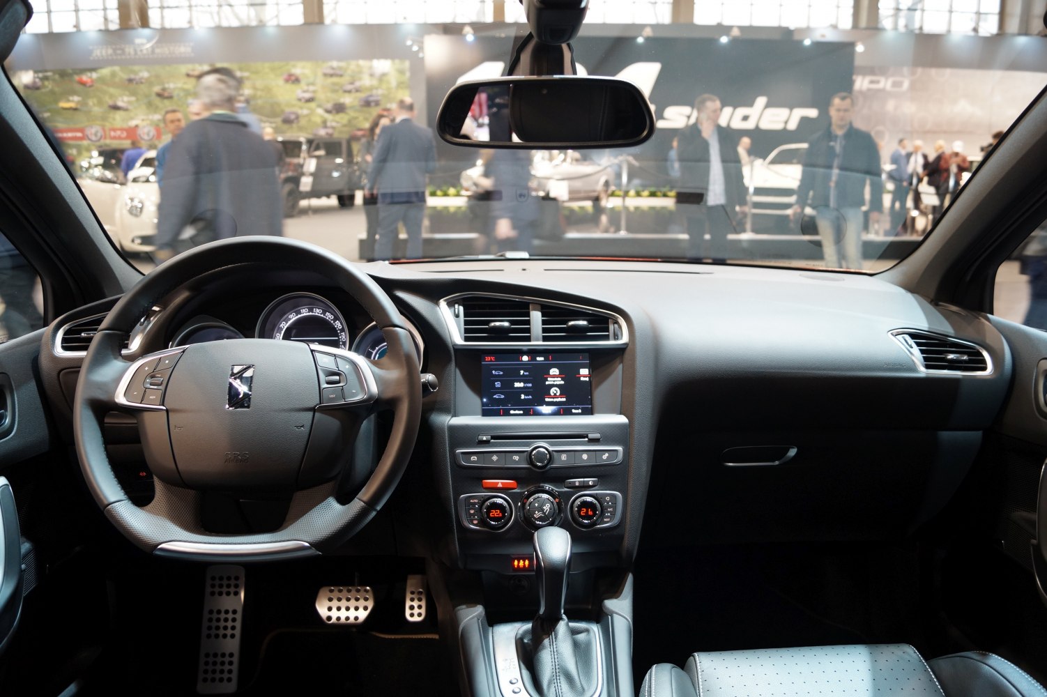 Steering wheel with multifunction buttons and modern center dashboard layout