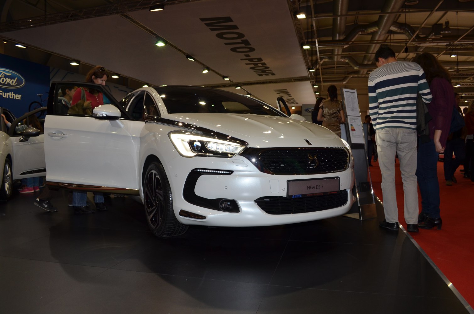 Close-up of car front with LED headlights and modern grille