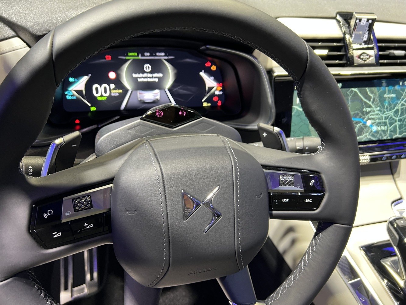 Steering wheel with control buttons and digital instrument cluster