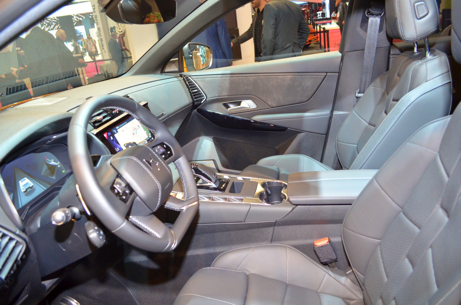 Modern car interior with digital displays and leather seats