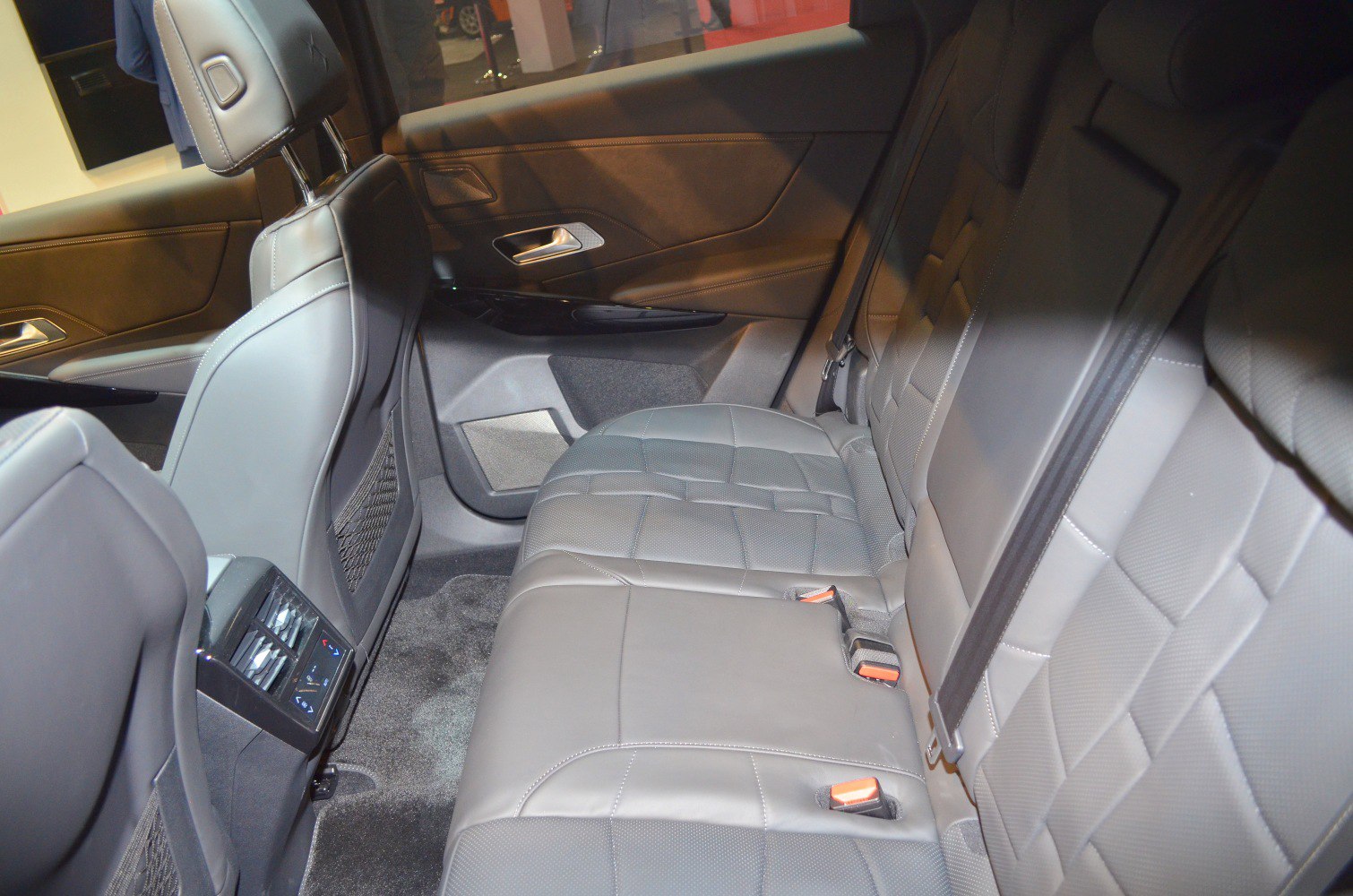 Luxurious rear seat interior with leather upholstery and rear climate controls.