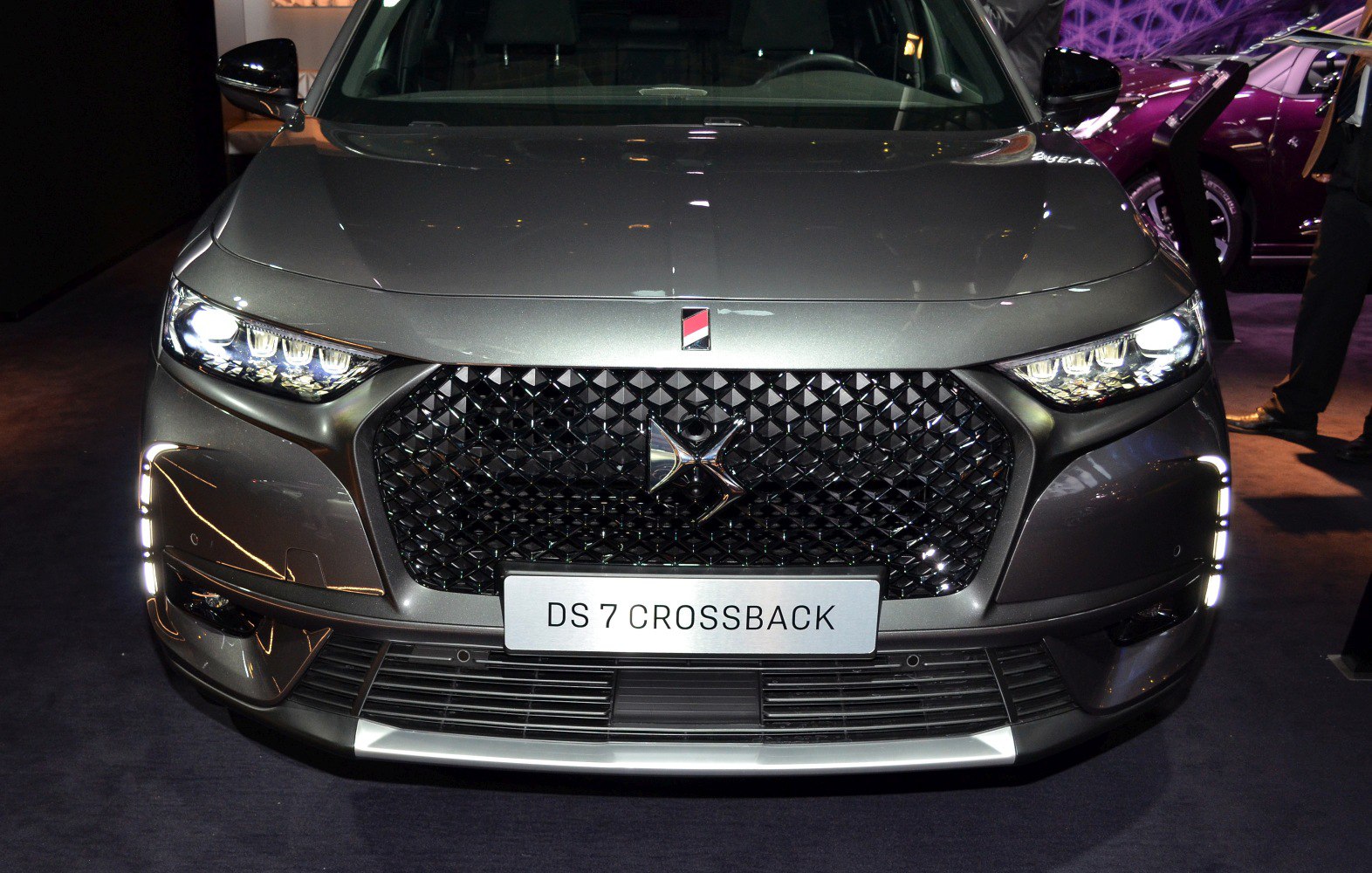 Diamond-pattern grille and LED headlights close-up
