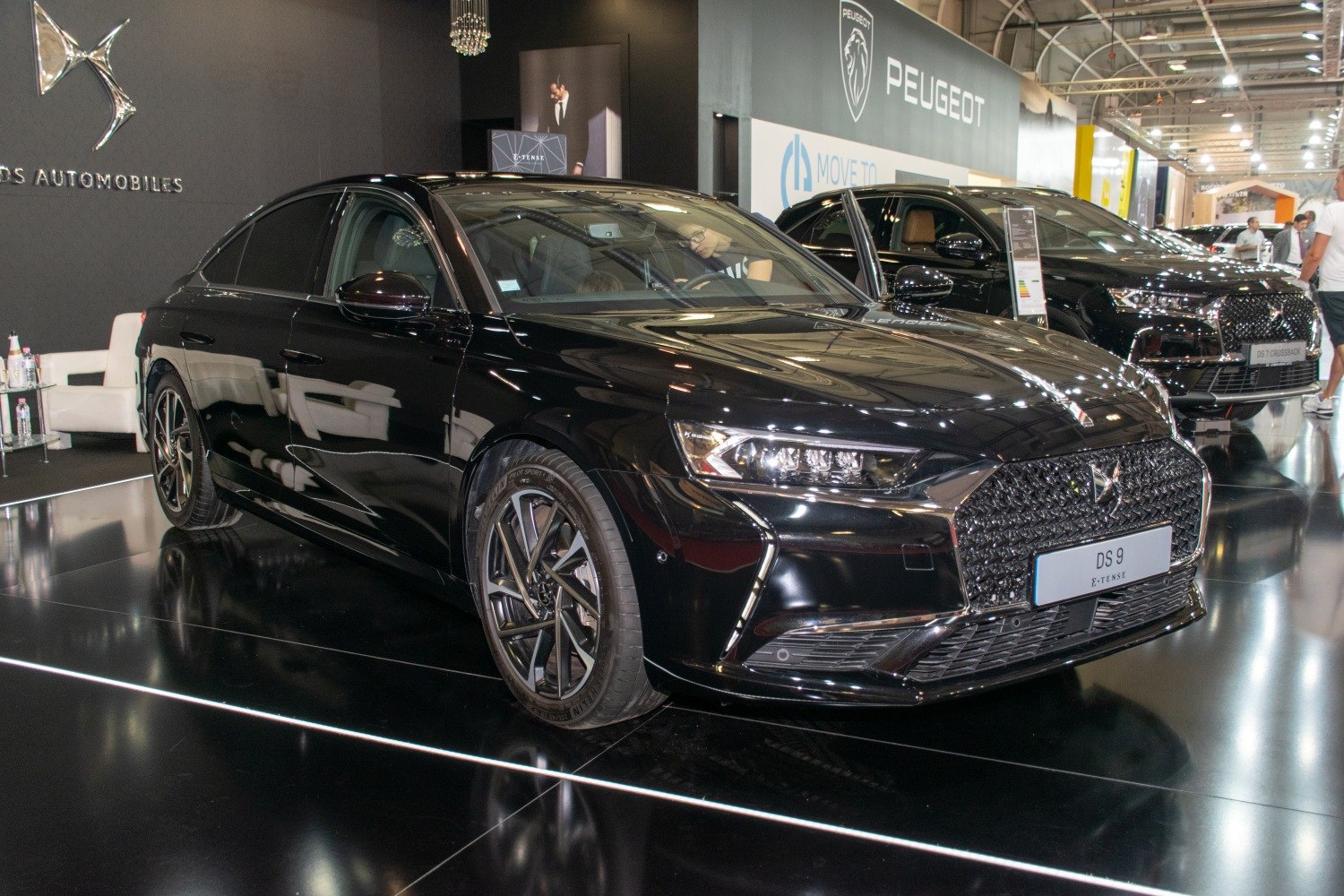 Luxury sedan front view with distinctive grille and sleek headlights