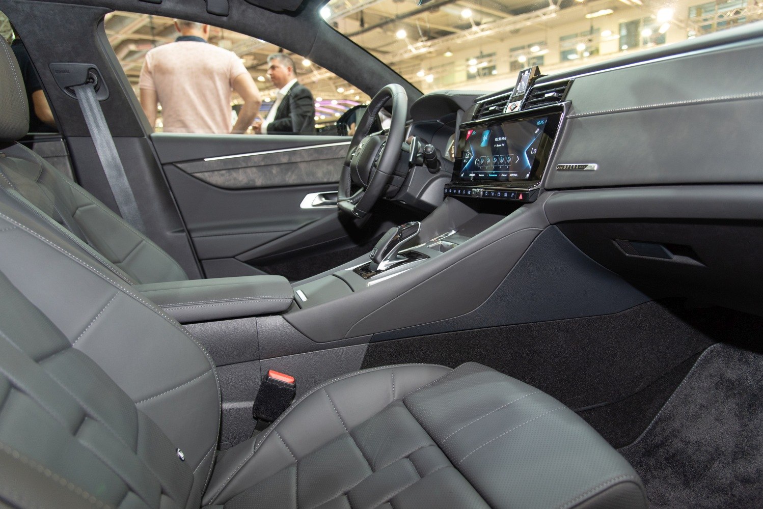 Luxury leather seats and digital touchscreen dashboard with modern controls.