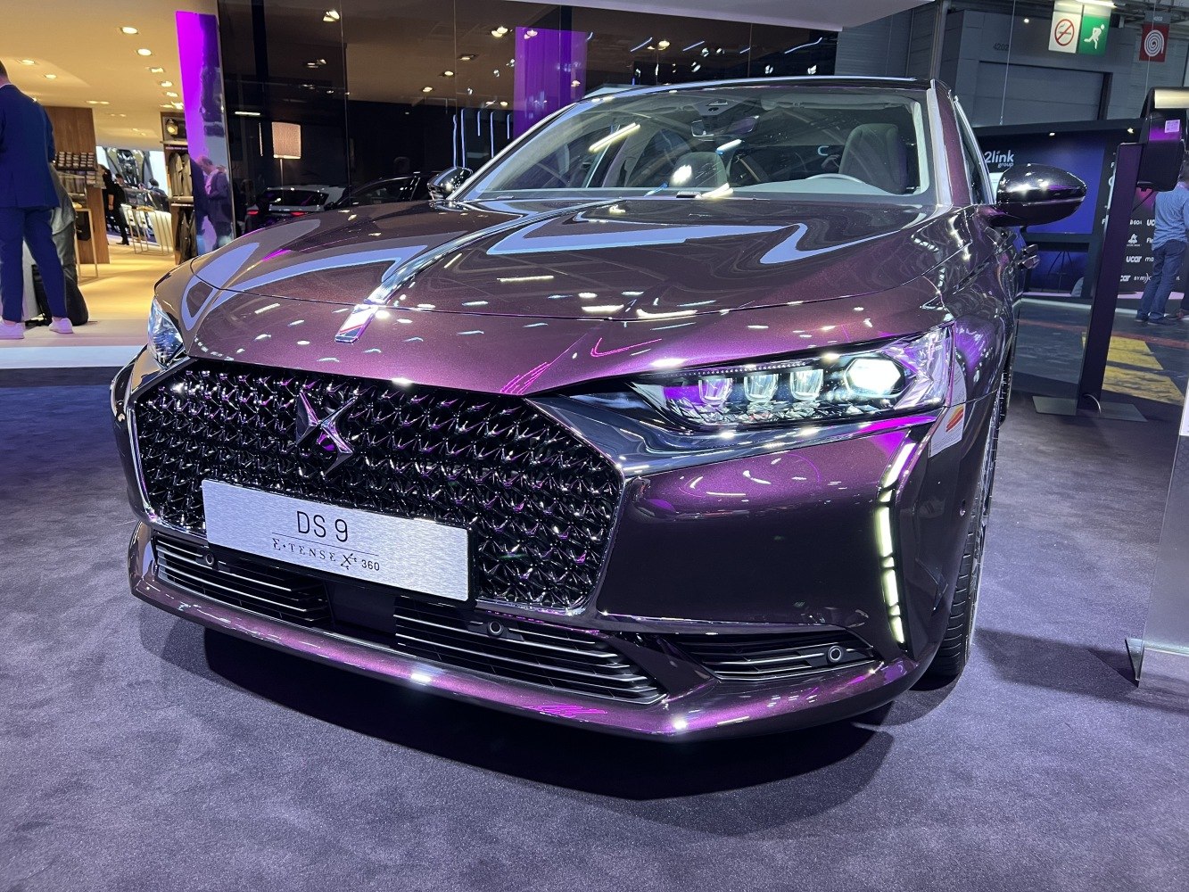 Close-up of luxury sedan front grille and LED headlights