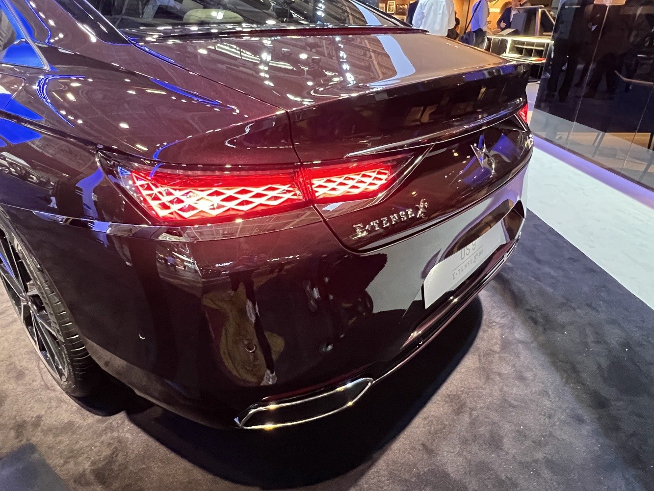 Distinctive rear with illuminated diamond-pattern tail lights and sleek exhaust tip.